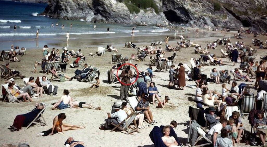 TIME TRAVEL SCANDAL: “1943 Beachgoer Clearly Using iPhone,” Internet Experts (who definitely have degrees in vibes) Conclude